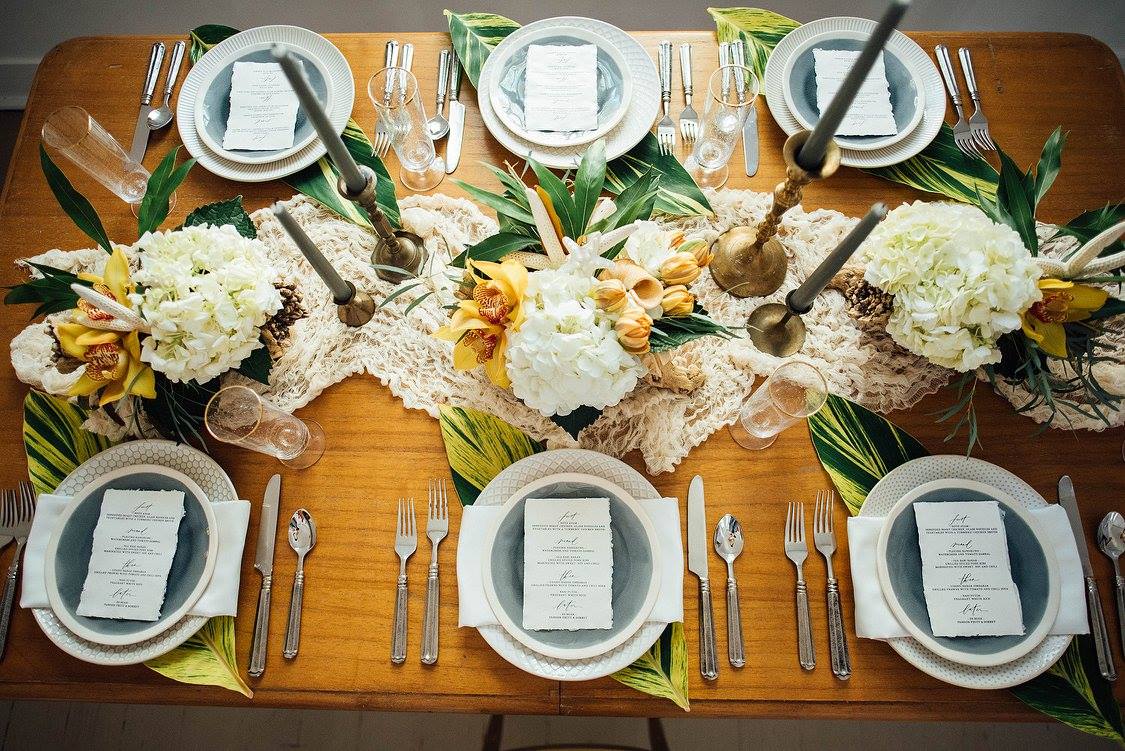 White and yellow table setting for Tropical themed wedding